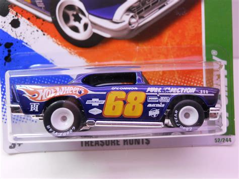 White, w/yellow, pink, & blue stripes on sides & hood, easter deco on sides, blue malaysia base, w/gold/blackoh5sp's. hot wheels super treasure hunt 57 chevy (2) | justjdm ...