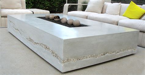Use cement outdoor floor tiles to create a patio living space complete with comfortable furniture and even an outdoor fireplace. Concrete Fire Table | CHENG Concrete Exchange