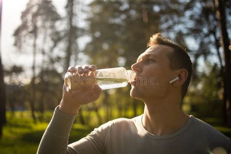 Thirsty Athlete Drinking Water After Workout Young Sportsman Drinking