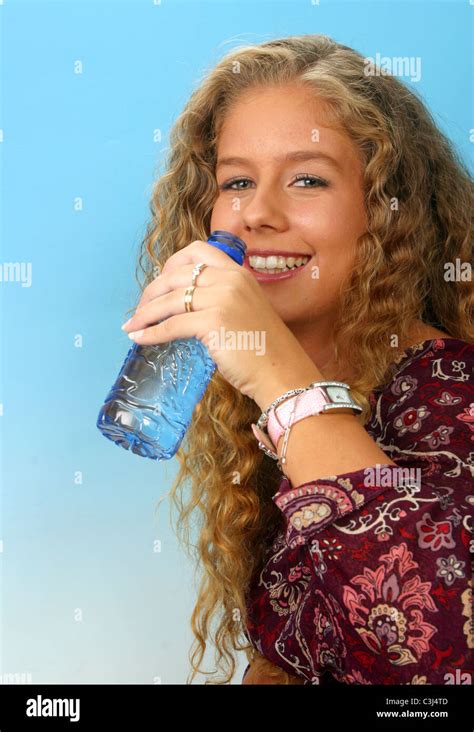 Young Woman Drinking Bottled Water From Plastic Bottle Stock Photo Alamy