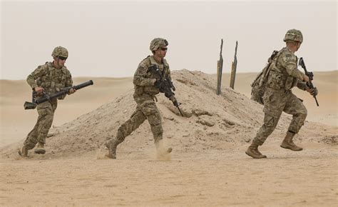 Us Infantry Soldiers Assault Through The Desert Live Fire Exercise U