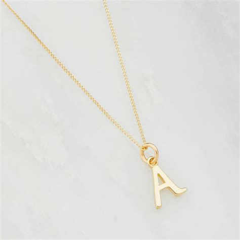 Gold letter charms for necklaces. Gold Or Silver Curve Initial Letter Charm Necklace By Lily & Roo | notonthehighstreet.com