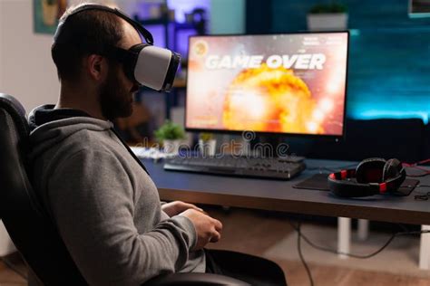 Adult Using Vr Glasses To Play Video Games On Computer Stock Photo