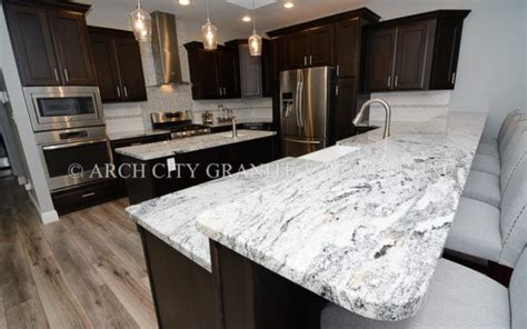 I see soooo many homes with this look these days. Lighter version Silver Cloud granite installed with dark ...