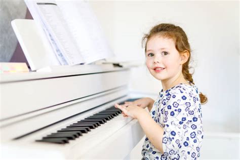 Best Portrait Of A Cute Baby Playing Piano Stock Photos Pictures