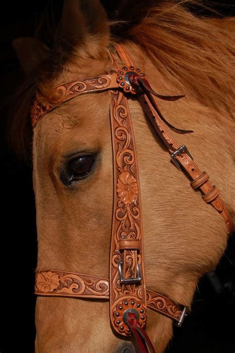 Beautifully Detailed Hand Tooled Leather Bridle On A Chestnut Horse