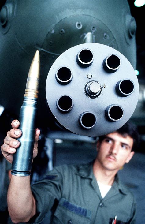 Usaf Ssgt Displays A Shell Used In The A 10 30mm Cannon 1984