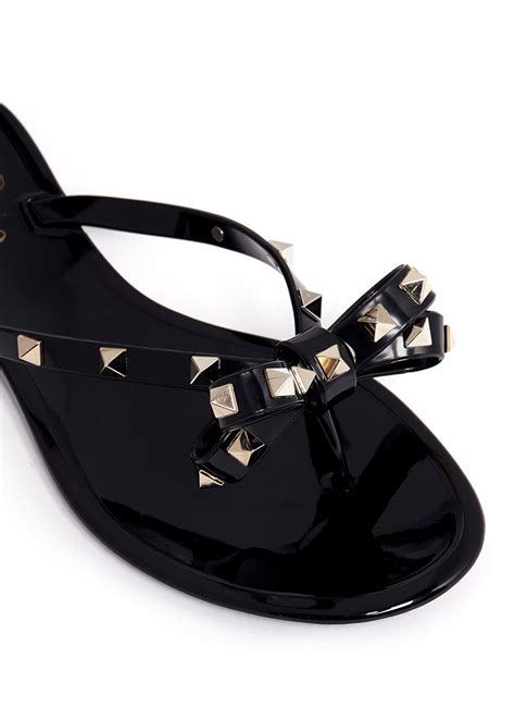 Lyst Valentino Rockstud Bow Flat Jelly Sandals In Black