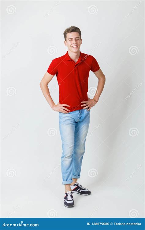Full Length Photo Of Friendly Looking Cheerful European Guy Wearing Red