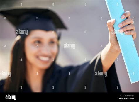 Its Official Shot Of A Young Woman Holding Her Diploma On Graduation