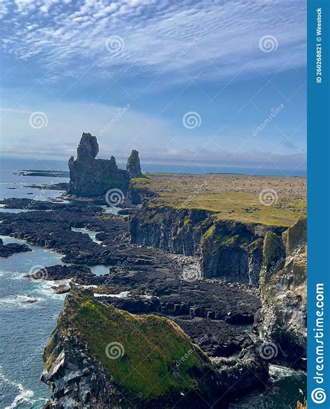 View To Londrangar Basalt Cliffs Surrounded By Turquoise Sea In Iceland