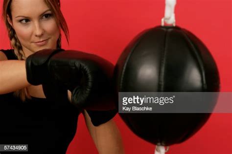 A Female Boxer Practicing With Punching Bag High Res Stock Photo