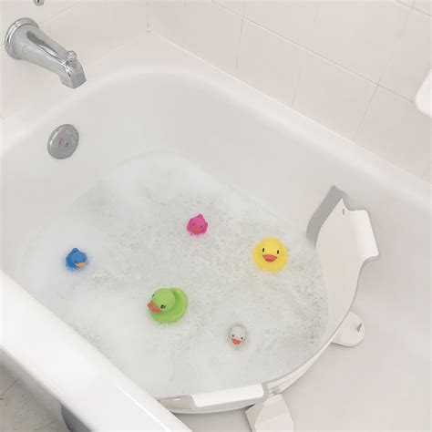 You can gently splash or pour warm water over your baby to keep them warm in the tub. BabyDam Bathtub Divider
