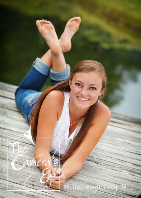 Senior Pictures With A Casual Outfit On A Dock By The Water Senior