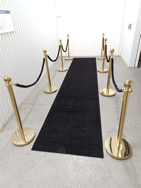 Gold Stanchions With Black Ropes And Black Carpet Runner Carnival Rides Karaoke Party