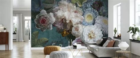 A Living Room Filled With Furniture And Flowers On The Wall