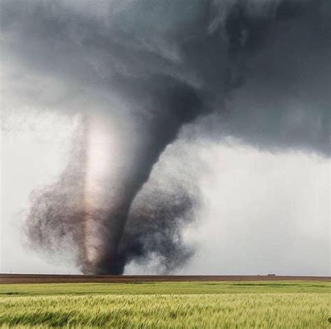 A Tornado From A Supercell Thunderstorm Over A Pristine Farm By Brett