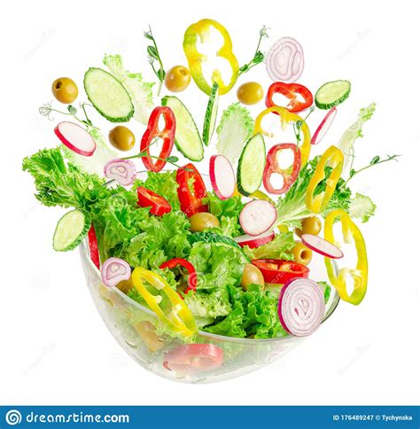 Fresh Vegetable Salad In Transparent Bowl With Flying Ingredients