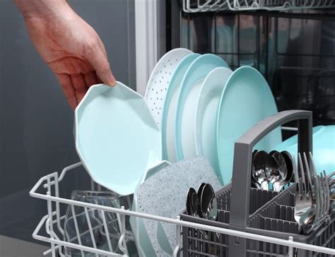 Premium Photo Man Empty Out The Dishwasher In Kitchenclose Up Of