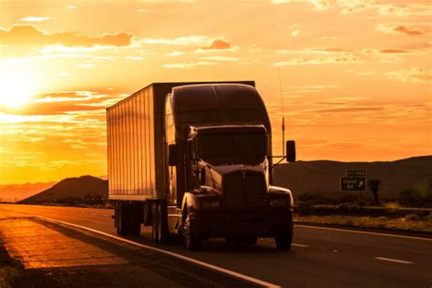 Truck On Highway At Sunset Stock Photo Download Image Now Istock