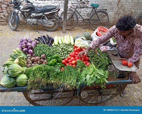 A Vegetable Vendor Selling Fresh Vegetables During The Lockdown In