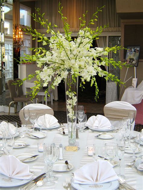 Stunning And Elegant All White Dendrobium Orchid Centerpiece By Jacquel Orchid Centerpieces