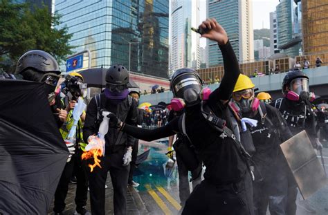 Hong Kong Police Fire Water Cannons And Tear Gas At Protesters As