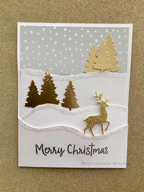 A Christmas Card With Gold Glitter Reindeer And Trees