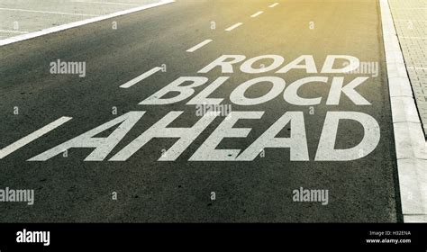 Road Block Ahead Message On The Highway Lane Traffic Signs And