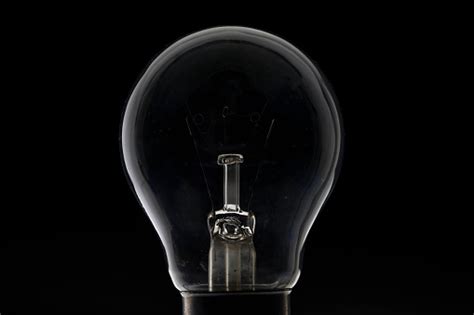 Light Bulb On Black Stock Photo Download Image Now Istock