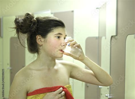 Teenager Girl With Towel And Water Glass After Shower Stock Photo Adobe Stock