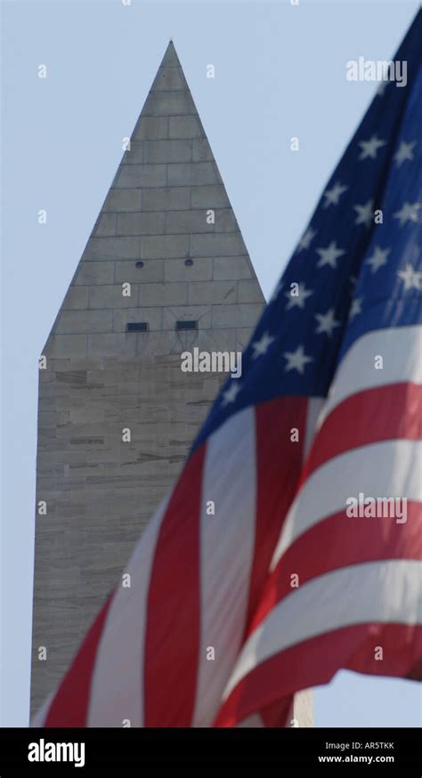Stars And Stripes In Front Of The Washington Monument Dc Stock Photo