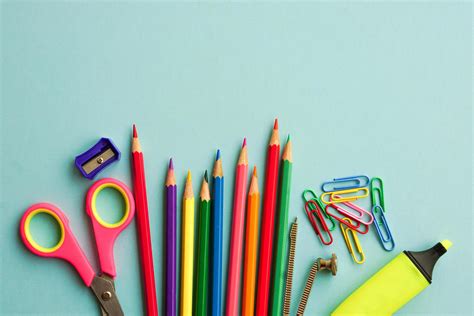 Top View Of School Supplies And Office Supplies On Blue Background