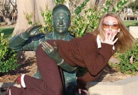 19 people having too much fun with statues