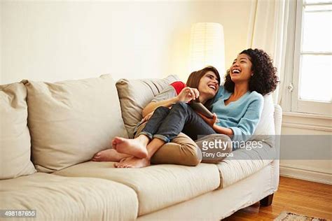 lesbian couple on couch photos and premium high res pictures getty images