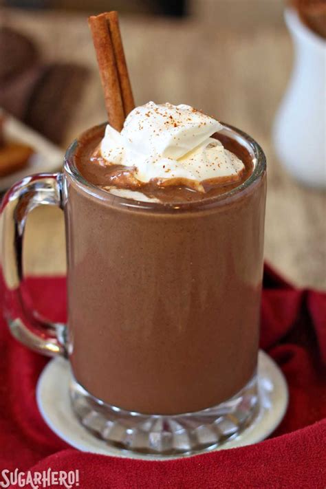 Hot Chocolate Drink With Whipped Cream And Cinnamon Sticks