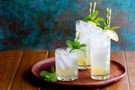 Three Glasses Filled With Lemonade And Mint On A Plate