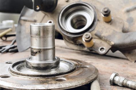 Old Oiled Wheel Hub Lies On A Wooden Table Stock Image Image Of Axle