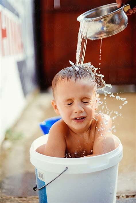 Boy Is Playing With The Water By Stocksy Contributor Jovana Vukotic