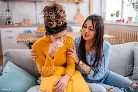 Young Woman Comforting Her Sad Friend Stock Photo Download Image Now