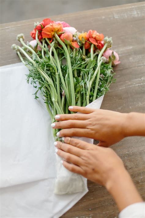 Extend the life of your bouquet by following these steps. How To: Wrap A Bouquet | A Pair & A Spare
