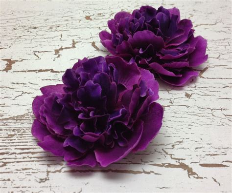 Inspired by the grace of your garden, faux florals lend earthy elegance to your ensemble. Silk Flowers Two Peonies in Deep Raspberry Purple Smaller