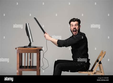 Angry Man Is Destroying A Keyboard Stock Photo Alamy