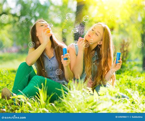 Beauty Girls Blowing Soap Bubbles In Spring Park Stock Image Image Of Laughing Nature 69698611