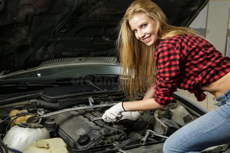 Beautiful Girl Mechanic Repairing A Car Stock Photo Image Of Blue
