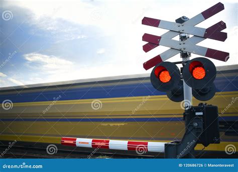 Riding Train Passing Railroad Crossing With High Speed Train Stock