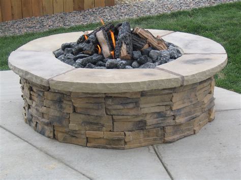 Lava rock, fire glass, and log sets can be used to complete your fire pit. Review In Ground Gas Fire Pit Construction | Garden Landscape