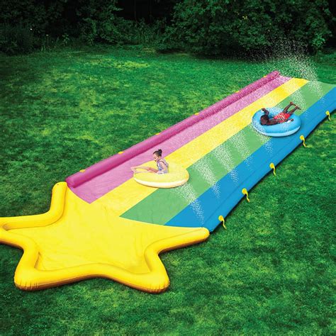 This Enormous Rainbow Slide Has A Pool And A Sprinkler