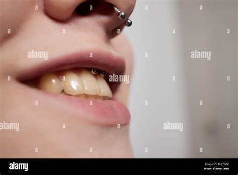 Smile Or Frenulum Piercing Under The Upper Lip Stock Photo Alamy