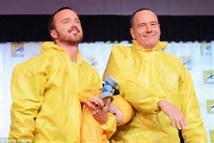 Breaking Bad S Drug Duo Aaron Paul And Bryan Cranston Hold A Fake Baby While Wearing Meth Suits